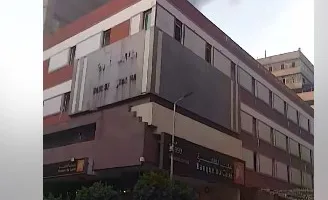 النيابة تندب المعمل الجنائي لمعاينة حريق مبنى إداري بوسط البلد