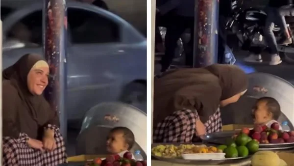 بـ رضا وحب.. فيديو لـ بائعة فاكهة تبتسم لـ صغيرها بعفوية يتصدر التريند بـ رضا وحب.. فيديو لـ بائعة فاكهة تبتسم لـ صغيرها بعفوية يتصدر التريند