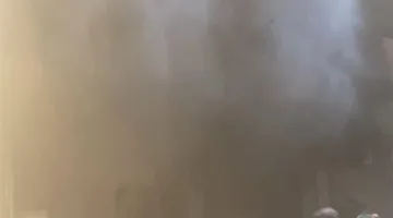 مصرع صغير في حريق محل ببرج سكني بشارع فيصل | صور