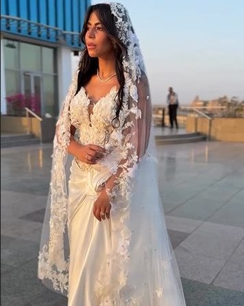 May be an image of 2 people and wedding
