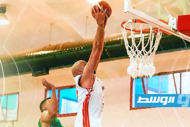 الأهلي بنغازي يحصد انتصارًا مثيرًا على الأهلي طرابلس في بداية نهائي بطولة كرة السلة. الأهلي بنغازي يحصد انتصارًا مثيرًا على الأهلي طرابلس في بداية نهائي بطولة كرة السلة.