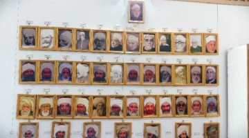 لوحة تكريمية تحتوي على صور وأسماء مشايخ الأزهر في معرض الكتاب الدولي بالإسكندرية