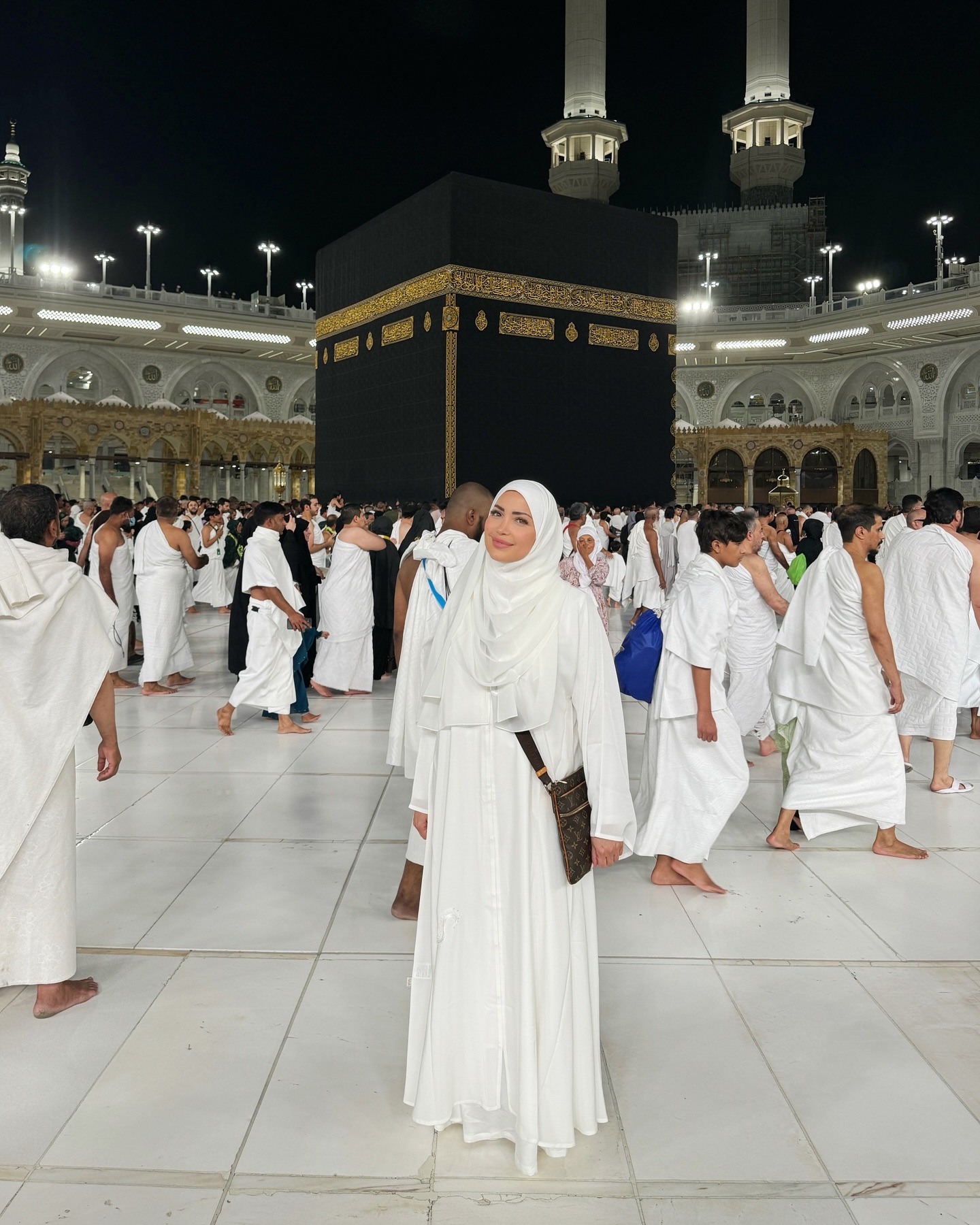 May be an image of 2 people, headscarf and text