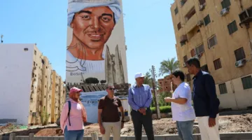 محافظ أسوان يزور مشروع “أرض من ذهب” الفني على واجهات أربع عمارات بطريق السادات