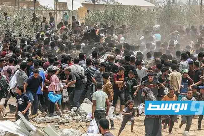 الدفاع المدني: 14 قتيلاً جراء نيران الاحتلال بالقرب من مركز توزيع المساعدات في غزة الدفاع المدني: 14 قتيلاً جراء نيران الاحتلال بالقرب من مركز توزيع المساعدات في غزة
