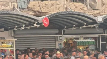 حل أزمة رواتب الحشد يثير مشكلة جديدة.. مئات الآلاف يتنافسون على نقاط صرف محدودة (صور)