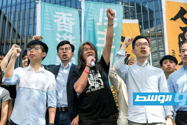 محاكمة 12 ناشطاً يدعمون الديمقراطية في هونغ كونغ محاكمة 12 ناشطاً يدعمون الديمقراطية في هونغ كونغ